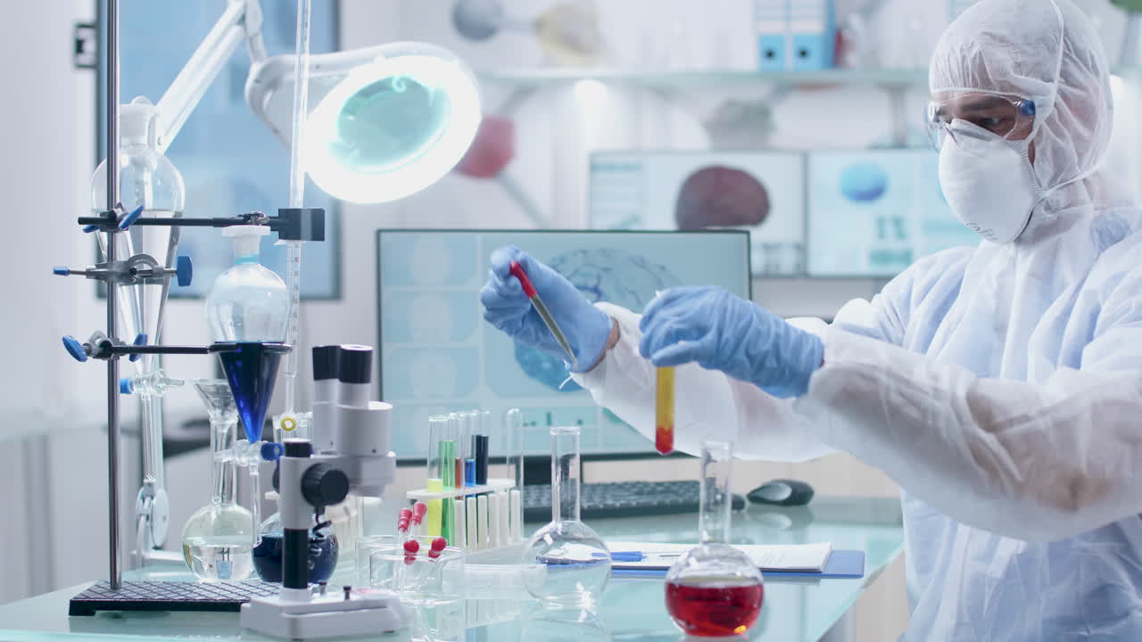 Scientist in laboratory researching a virus