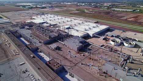 aerial view of rooftop of assembly plant, where are produced advanced machinery, automation, and a streamlined workflow in automotive manufacturing