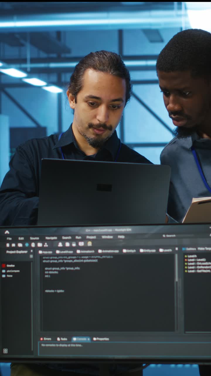 IT Professionals Collaborating on Software Development in a Data Center Office