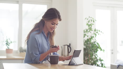 an-attractive-young-woman-using-her-credit-card