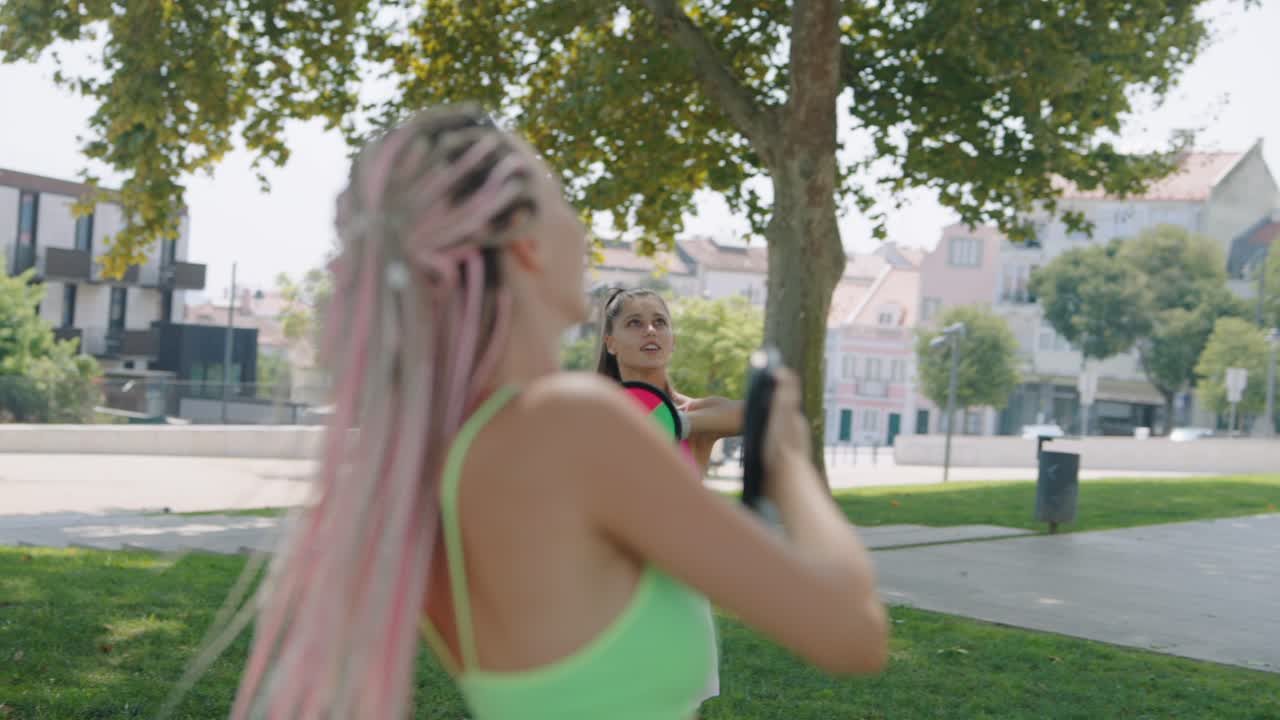 Women playing catch in the park