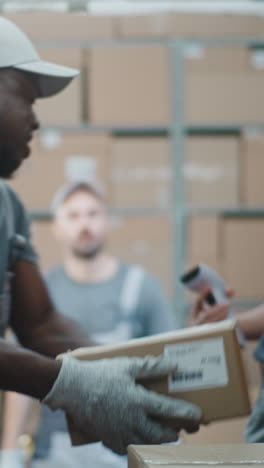 logistics team working in a warehouse, handling and scanning packages