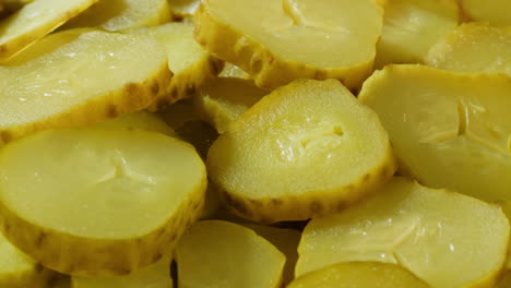 close-up of sliced pickled cucumbers