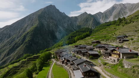 scenic mountain village with traditional houses on terraced slopes