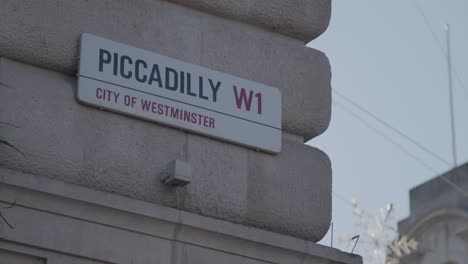 a street sign of piccadilly circus in london.
