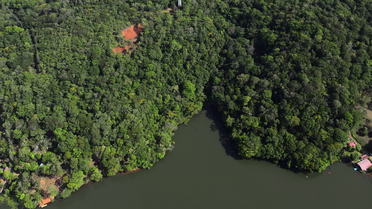 Aerial establishging shot of communication pylons in a forest in Cerro Azul