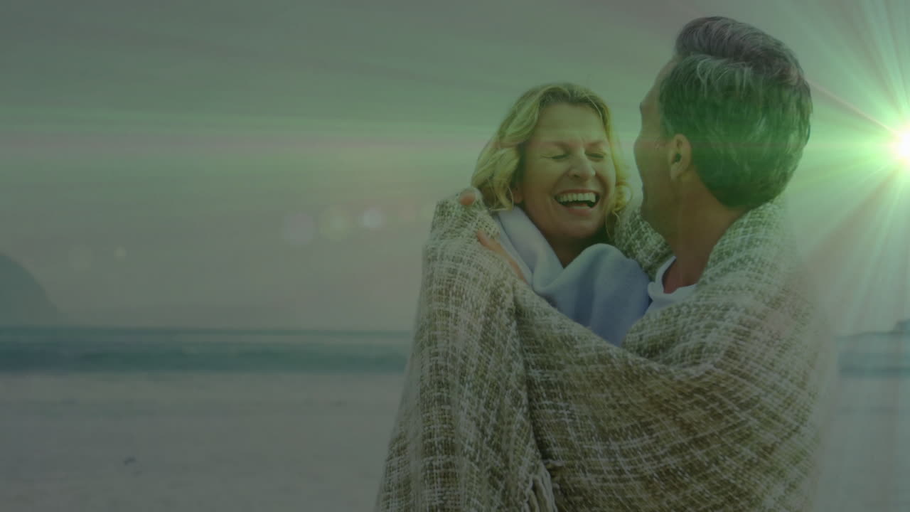 couple embracing on beach, showing marketing trends with animated floating charts