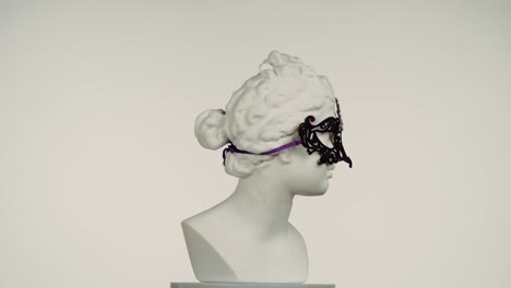 ancient bust with masquerade mask