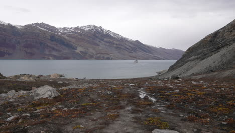 Cruise-Ship-in-Fjord-Water-Along-Coastline-of-Greenland-in-Summer-Season