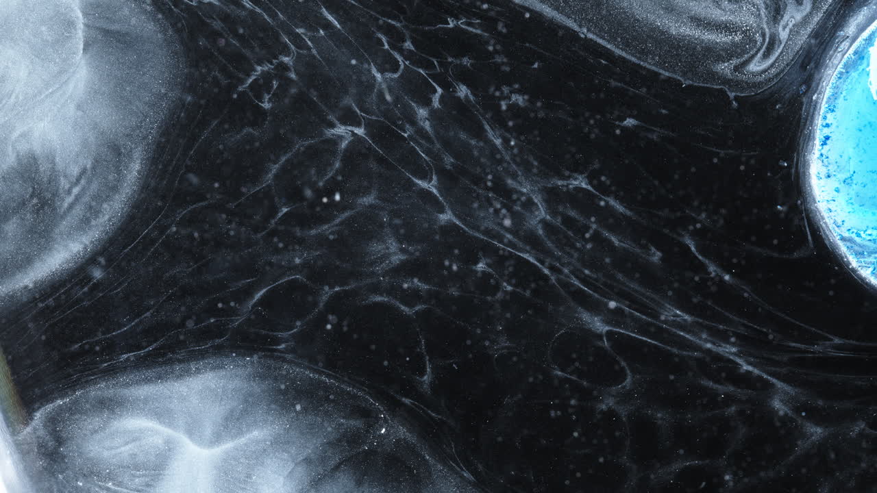 Stunning abstract view of alcoholic ink blending on a dark background, macro shot