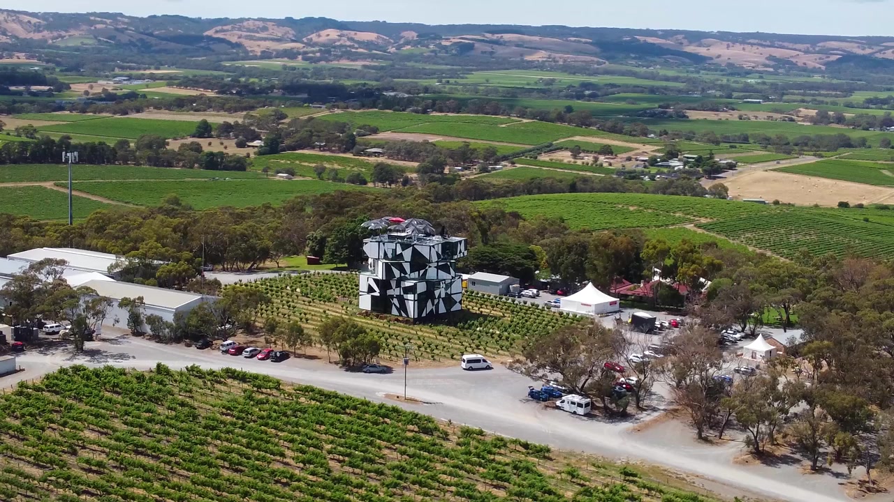 Drone footage of d'Arenberg Cube in McLaren Vale, South Australia. The unique structure, vineyards, and surrounding landscape create scenic visuals, perfect for showcasing wine regions.