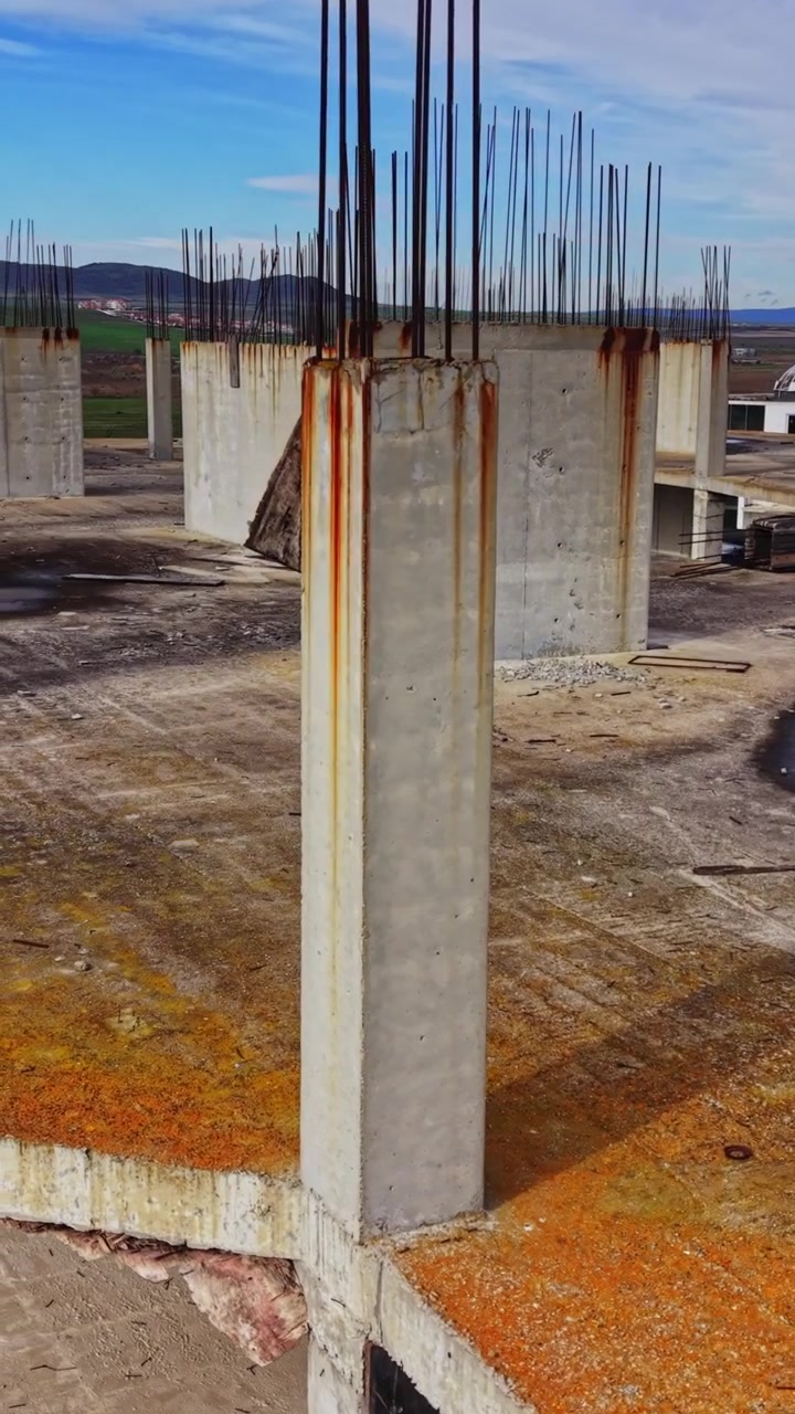 Aerial view of an unfinished concrete building under construction