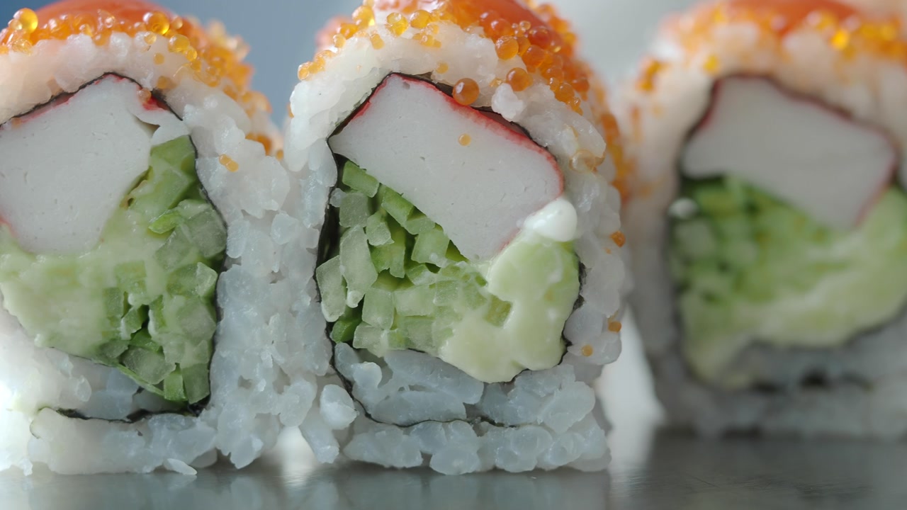 Close-up of Freshly Prepared California Sushi Rolls with Fish Roe