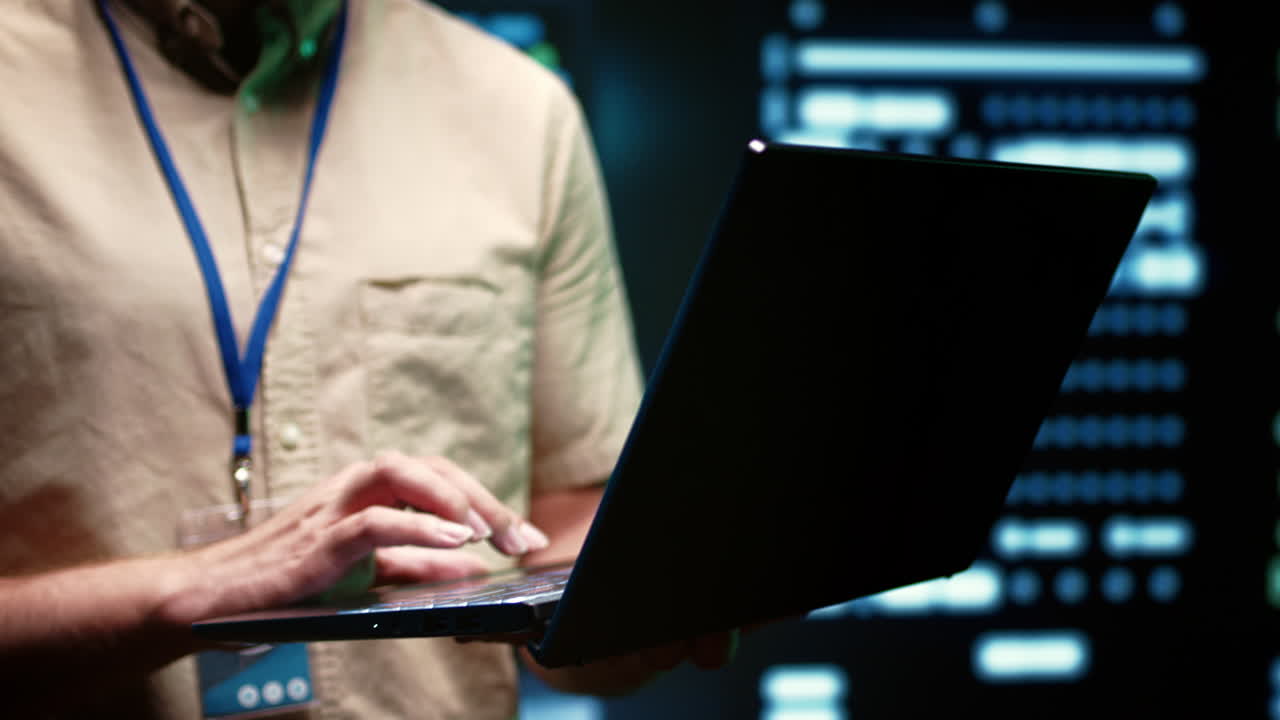 System administrator using laptop