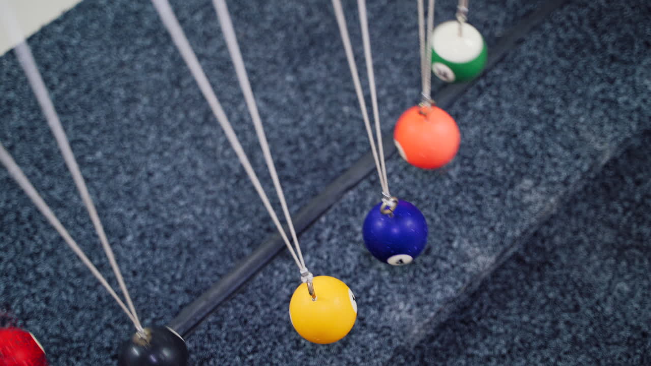 Newton's cradle showing laws of physics in motion. Museum of Science