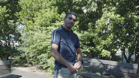 confident man with crossed arms changing body position, smiling