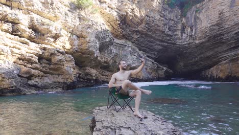 young man talking on the phone in the canyon.