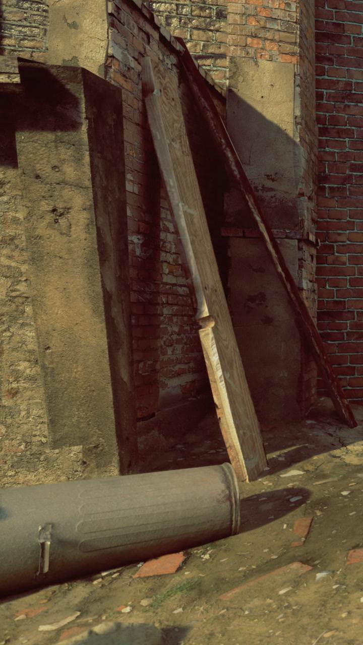 Garbage can lies on its side near old brick wall in urban area