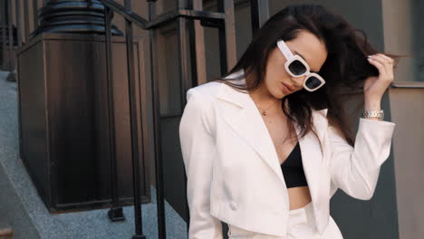 stylish woman in white blazer and pants