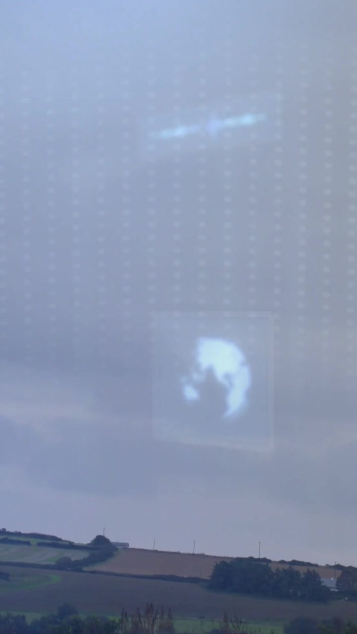 Vertical video: UI globe and gear icons drifting, frames lowering, revealing farmland for agritech