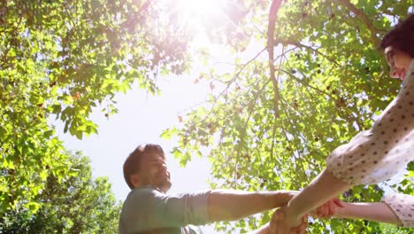 romantic couple playing in park