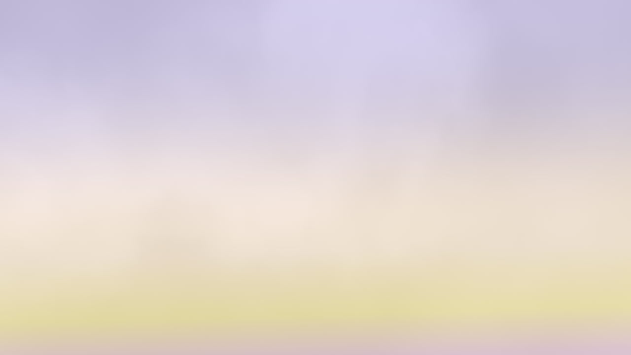 오렌지색, 노란색, 파란색의 혼합물인 흐릿한 구름과 함께 활기찬 일몰 하늘