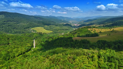 lush green landscape with rolling hills. vibrant greenery covers rolling hills under a clear blue sky in a picturesque rural area during daytime