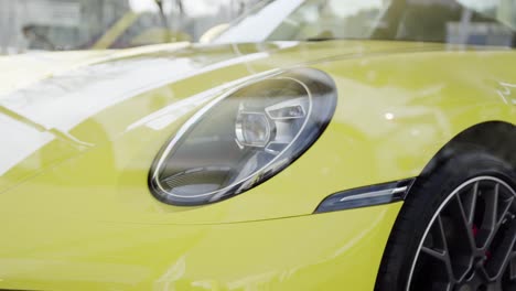 front end of modern yellow super car with some details in 4k