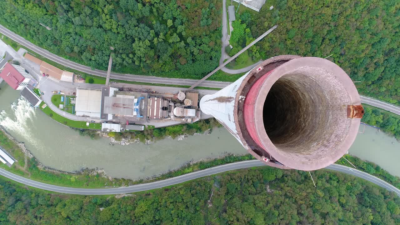 Aerial ascending flyover chimney top of Trbovlje power station, Slovenia