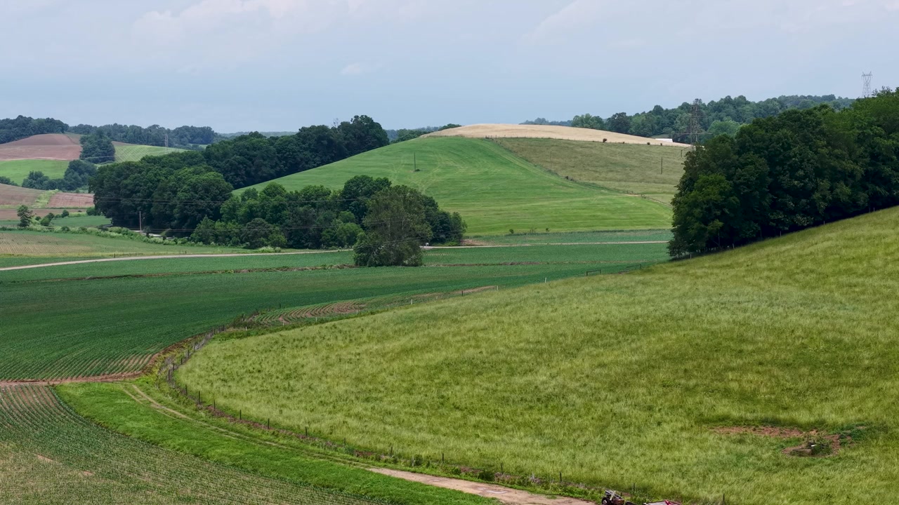 Rolling green farm fields spread across the rural hills near Dresden and New Moscow Ohio