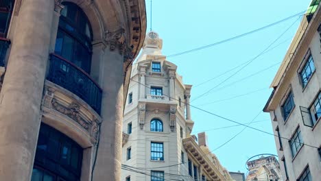 tilt up picturesque historic center ariztia building shot in la bolsa santiago de chile business neighborhood, nueva york street