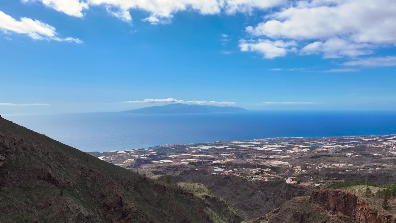 Stunning volcanic view of La Gomera from Tenerife, Canary Islands, serene mood