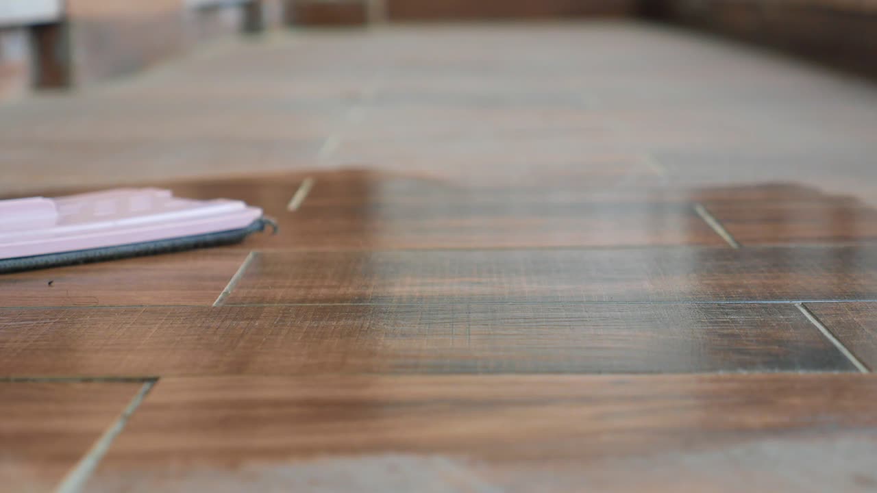 Cleaning a Wooden Tile Floor with a Mop