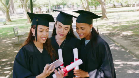 group of graduates using a phone for social media