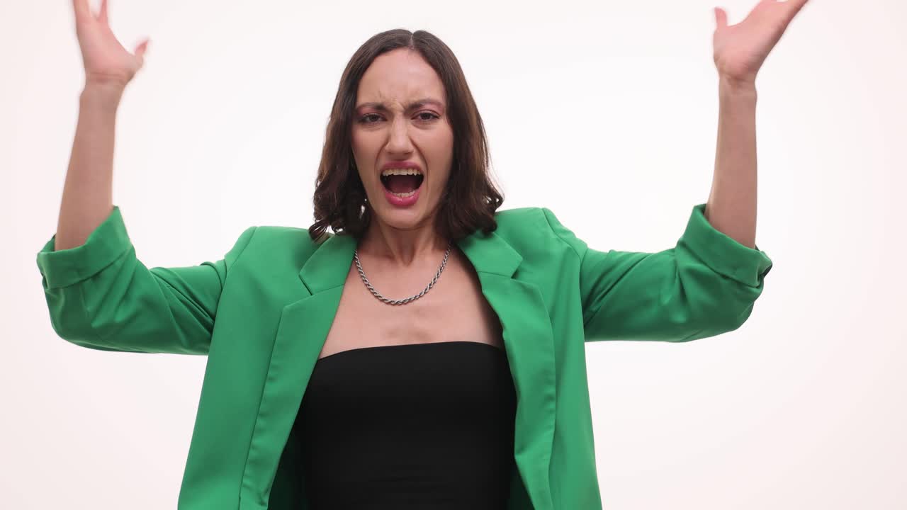 Woman expressing intense anger and frustration by tearing paper and yelling