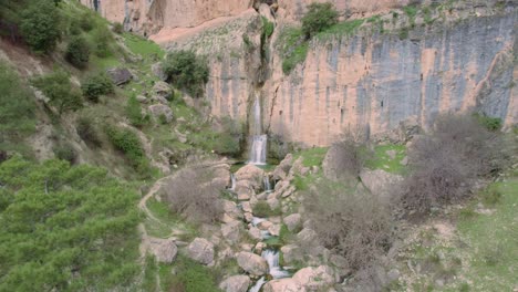 High-mountain-waterfall-in-the-forest