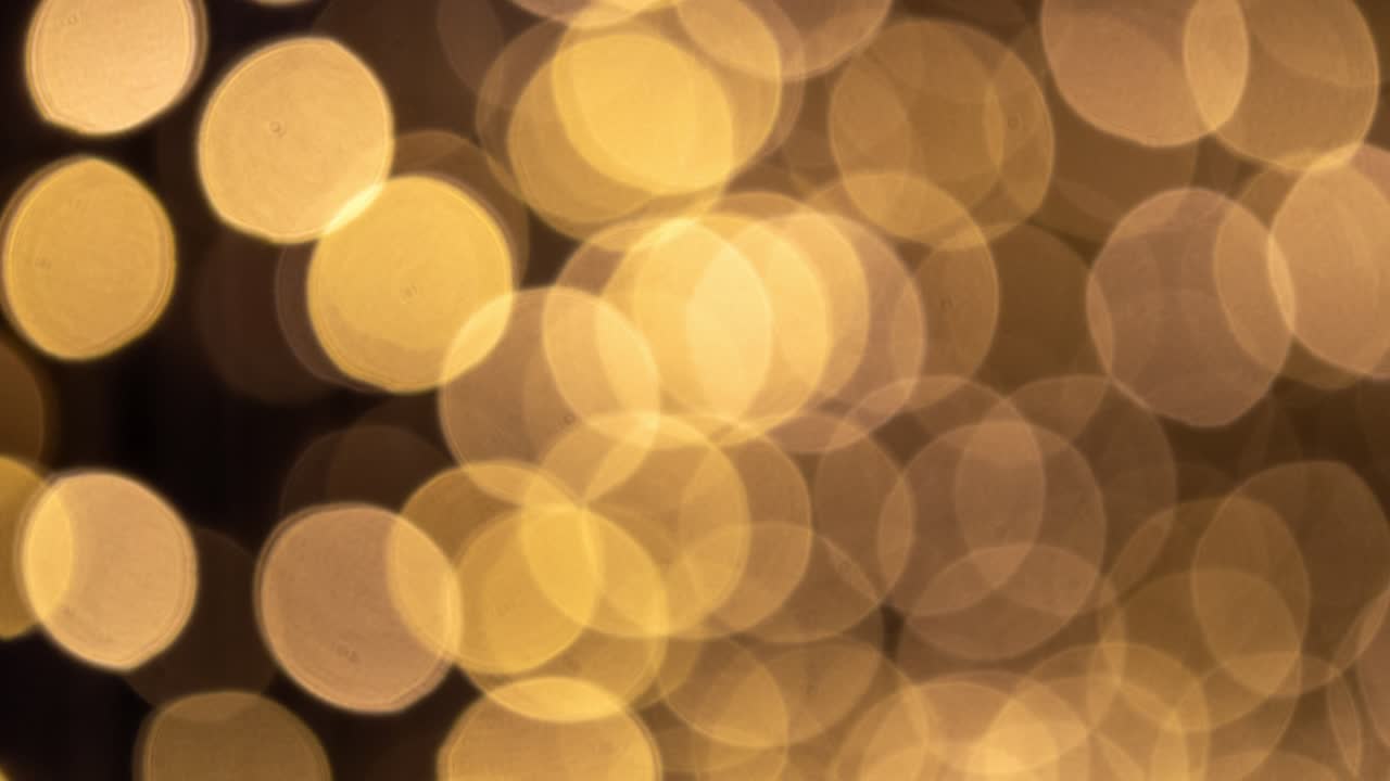 Stunning zoom video of golden bokeh lights indoor celebration artistic environment abstract view