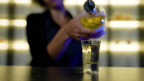 bartender serving a shot