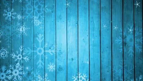 Animation-of-snowflakes-falling-on-blue-board-background