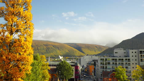 panning right across tromso city on coast of norway in autumn season