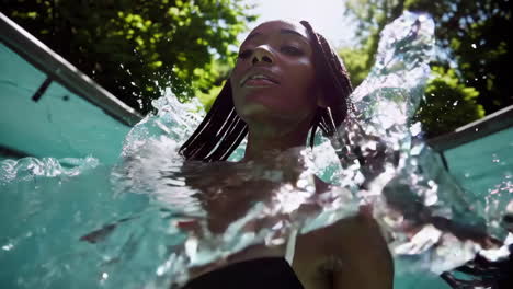 woman underwater in pool