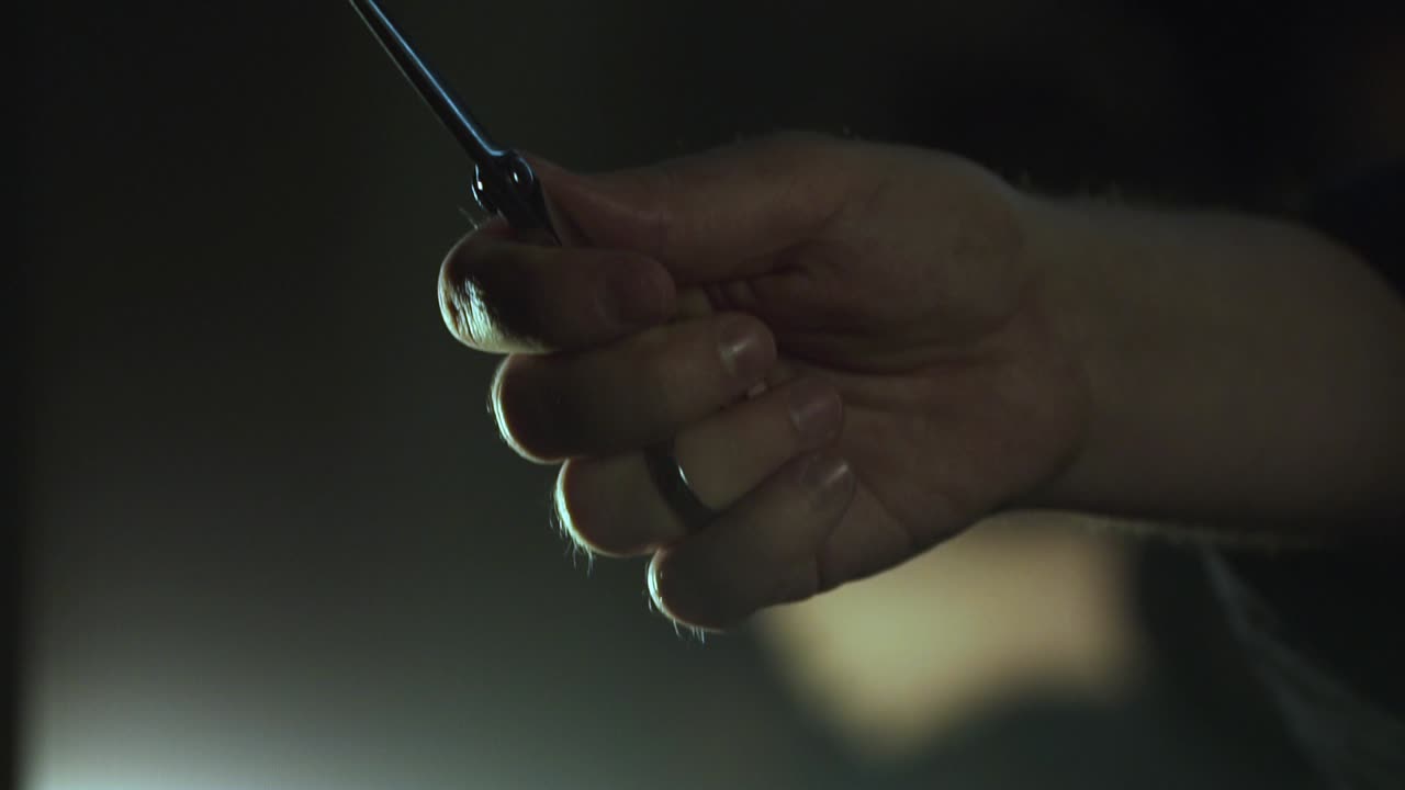 Hand Holding Scissors