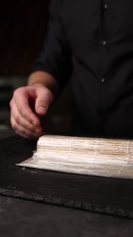 sushi chef preparing sushi rolls