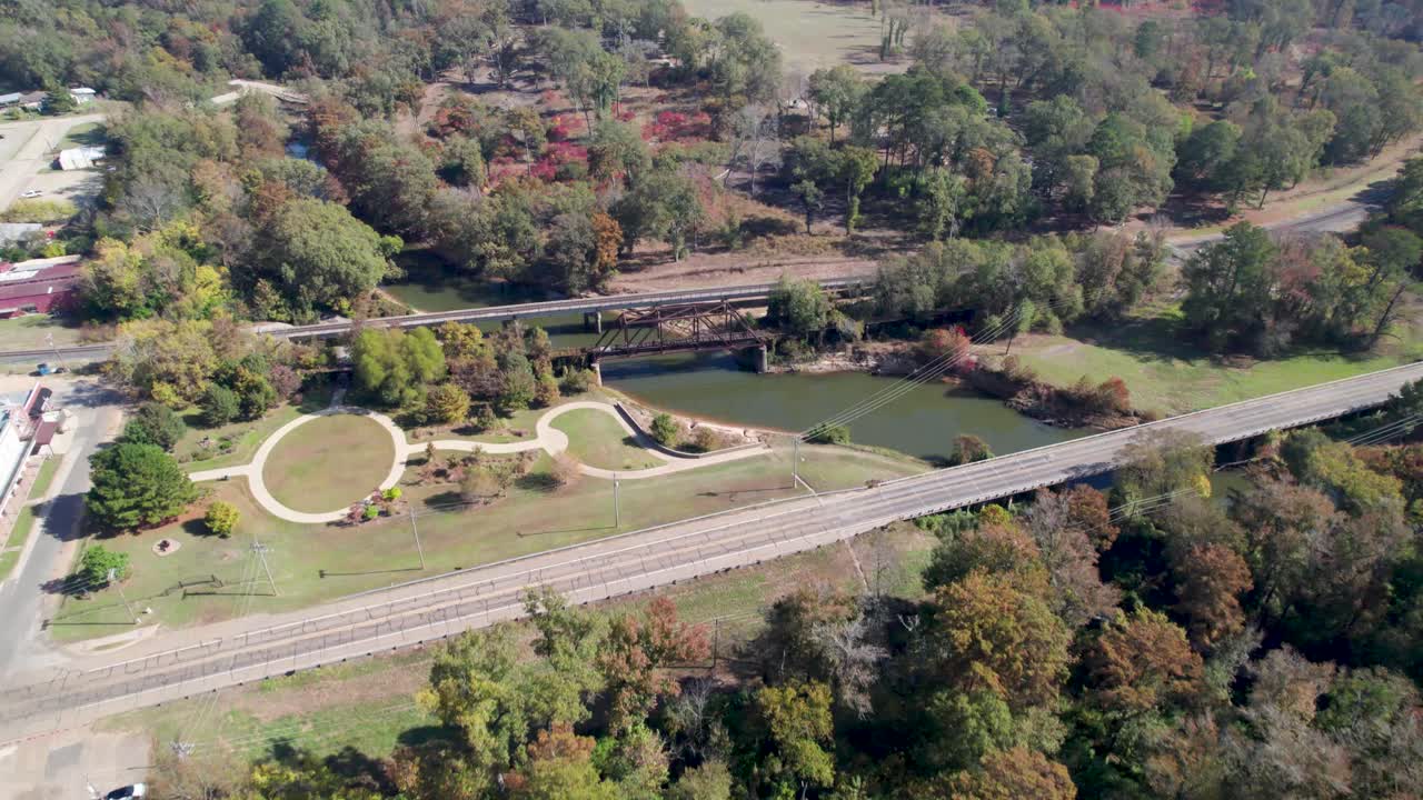 Aerial video of the Howe Truss Railroad Bridge over the Big Cypress Bayou in Jefferson, Texas
