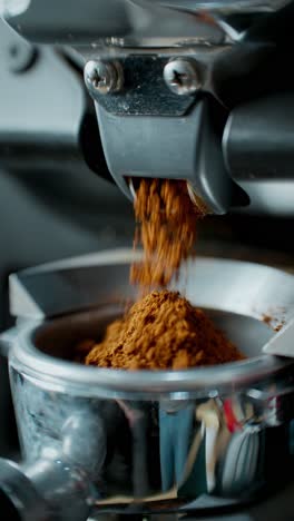 Close-up of Coffee Grinder Dispensing Grounds