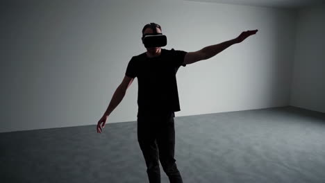 man experiencing virtual reality in an empty room