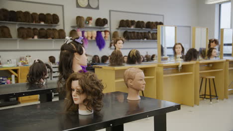 establishing shot of a hairdressing class in a trade school