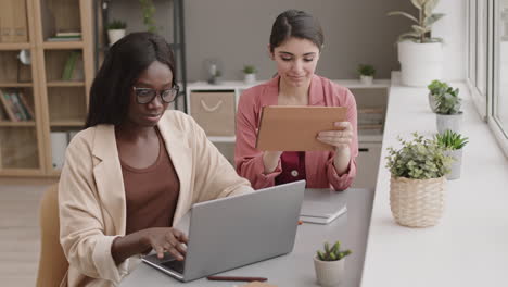 two businesswomen working together in office