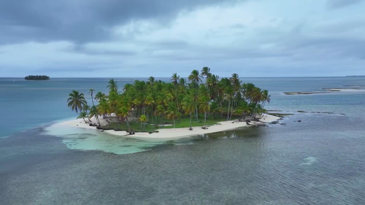Drone fly by of one of the San Blas Islands off the gulf coast of Panama. Drone right to left HD