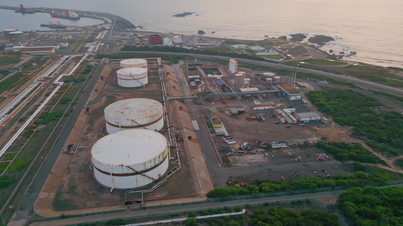 Drone oil terminal plant at sea port. Fossil fuel energy industry placed coast